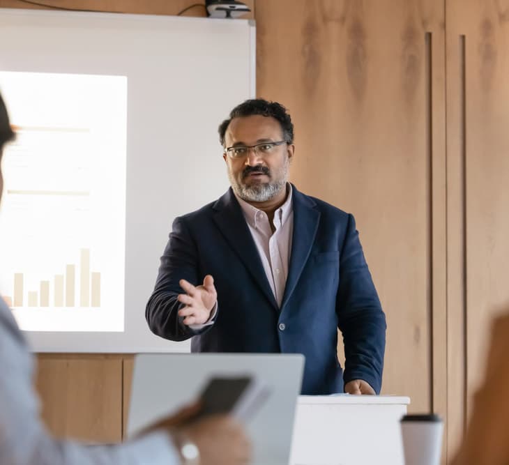 Serious,Confident,Mature,Indian,Business,Teacher,Giving,Seminar,To,Students,