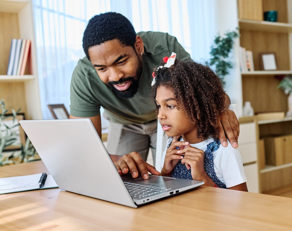 Father,And,Daughter,Doing,Homework,With,Laptop,At,Home.,Father